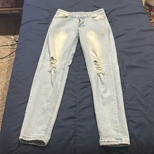 Light blue knee ripped jeans